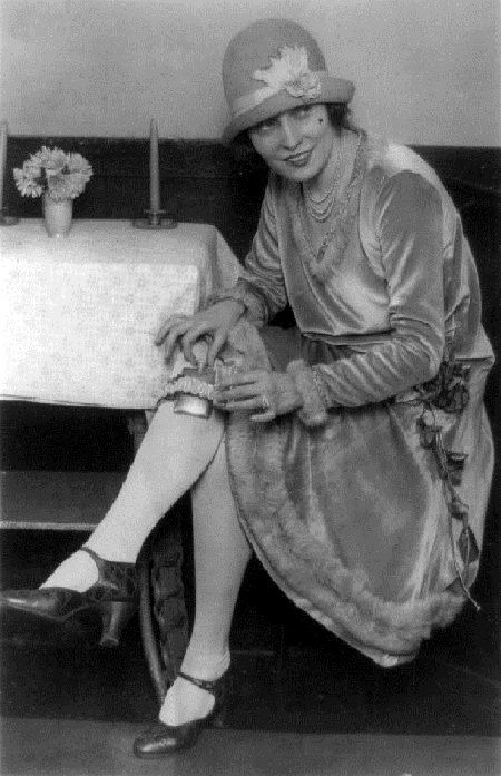 Flapper-sitting-at-table-with-a-flask-strapped-to-her-calf1.jpg
