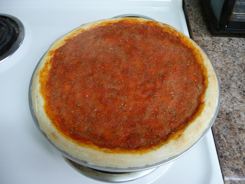Dough and sauce partially cooked