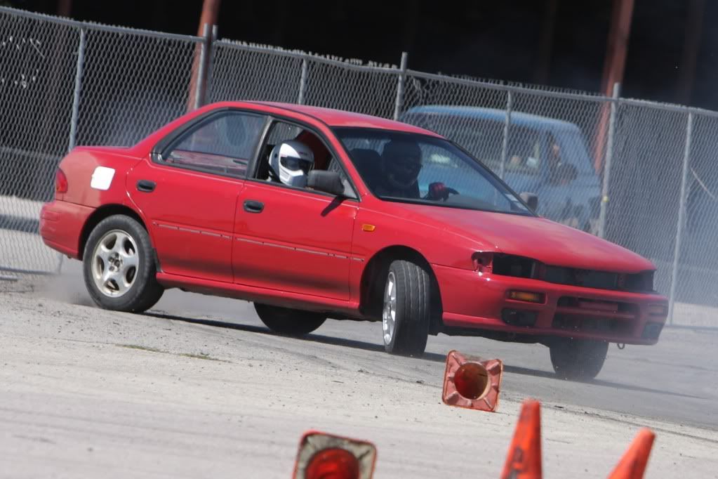 Drifting at the Travis County Expo Center, Draging the bumper along the fence. To much fun. By the way this is a rear wheel drive Subaru Impreza. We did the conversion our selves in my shop.